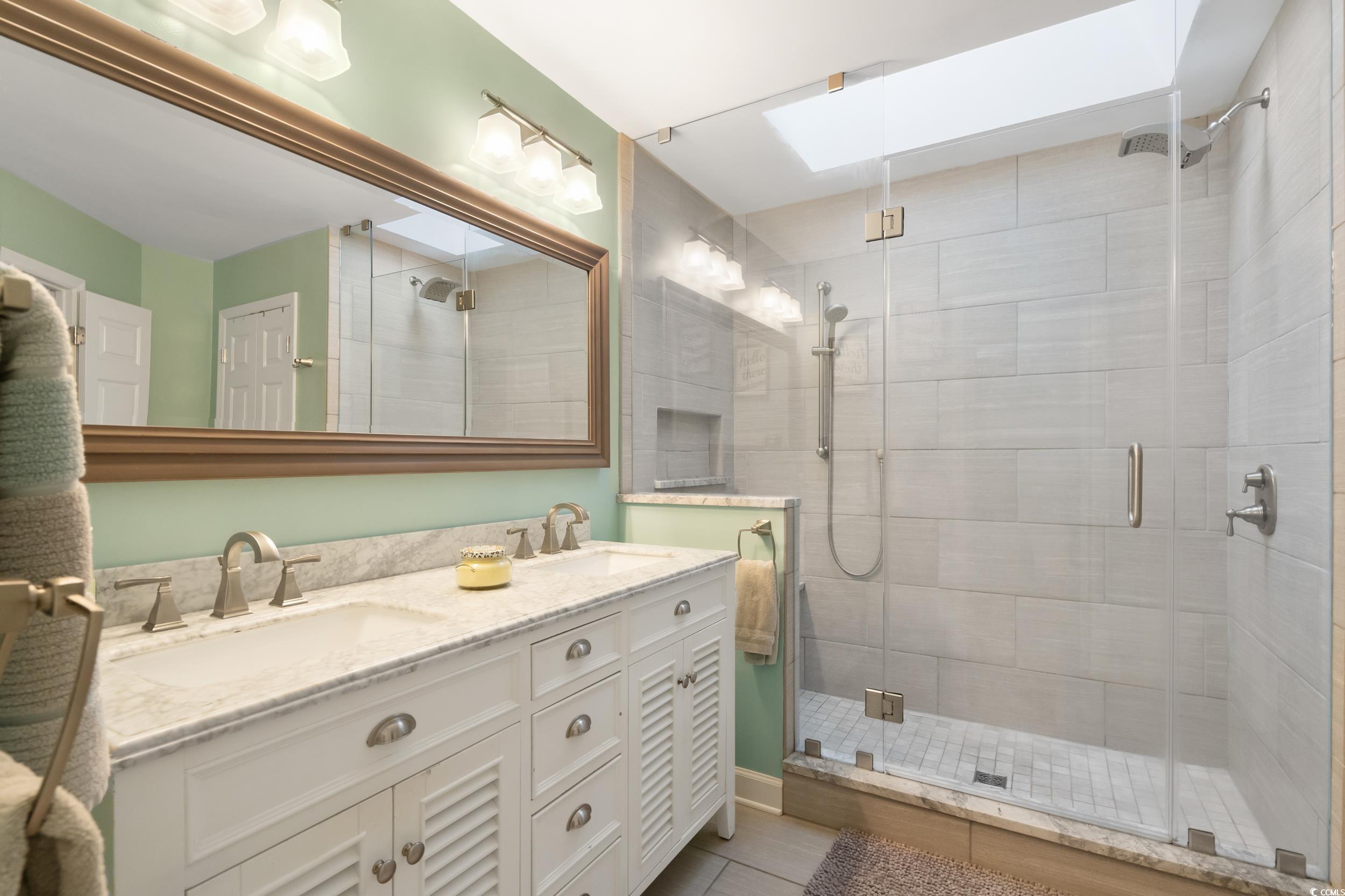 824 Mount Gilead Pl Drive Murrells Inlet, SC 29576 - Photo 25 of 40 Bathroom featuring vanity, a skylight, tile patter