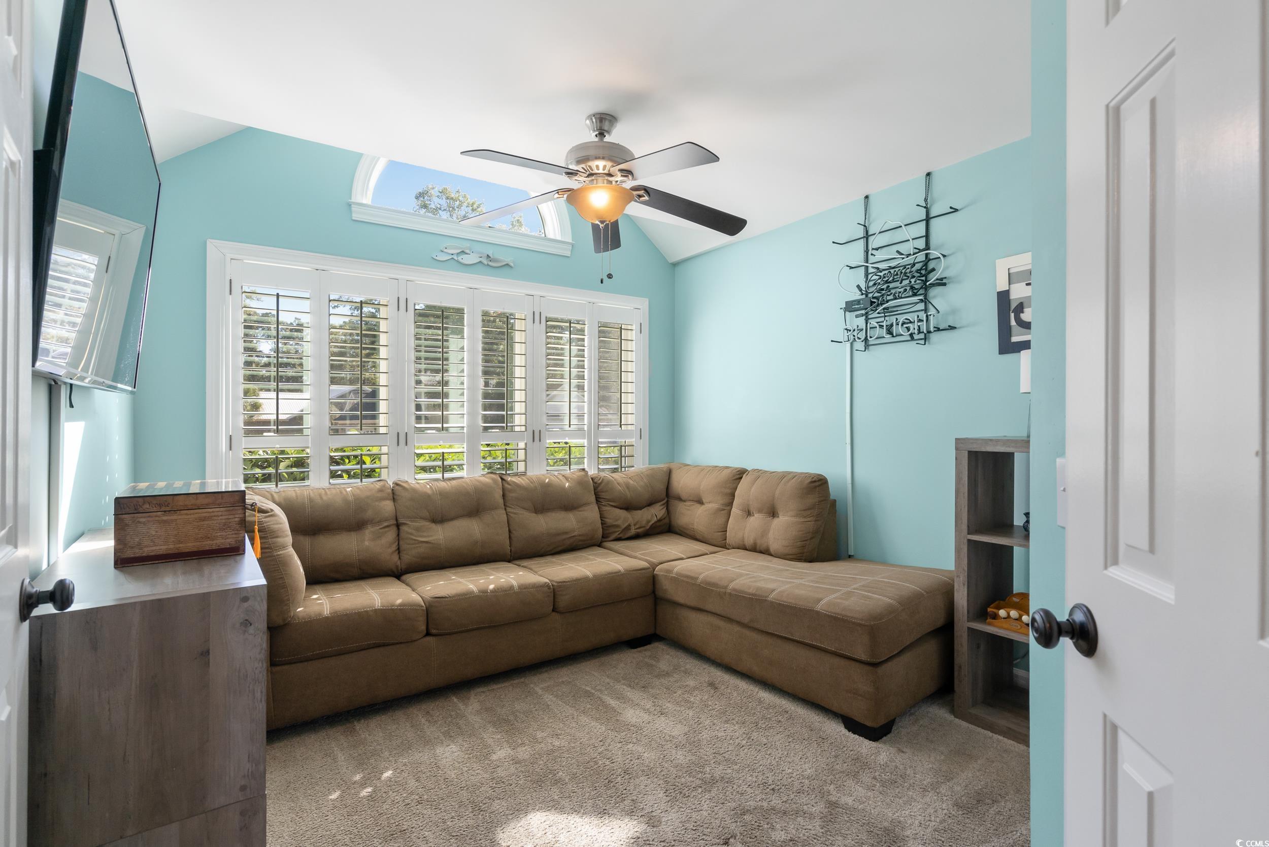 824 Mount Gilead Pl Drive Murrells Inlet, SC 29576 - Photo 27 of 40 Carpeted living room with ceiling fan and vaulted