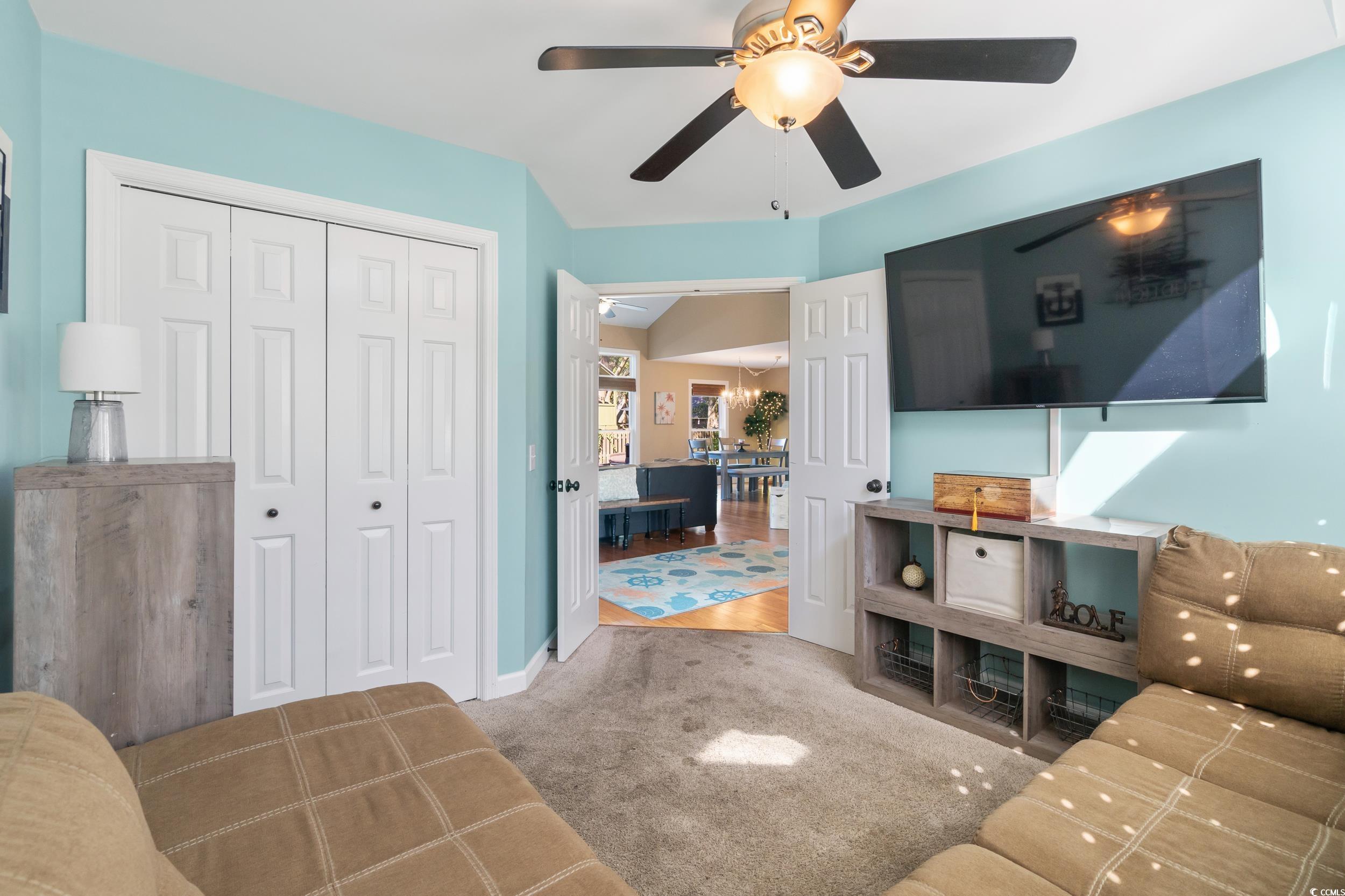 824 Mount Gilead Pl Drive Murrells Inlet, SC 29576 - Photo 28 of 40 Living room featuring carpet, ceiling fan, and vau