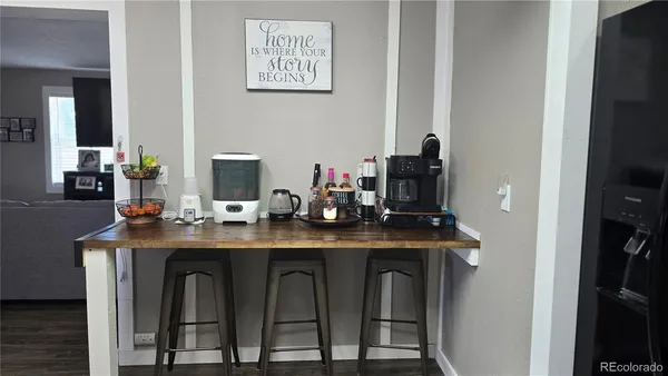 a dining table with chairs and wooden floor