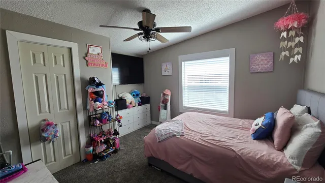 a bed room with a bed and a window