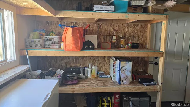 a kitchen with a table and chairs