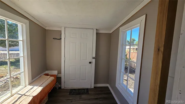a view of room with window and hardwood floor
