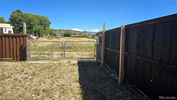 a view of a backyard of the house