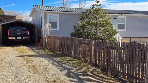 a view of a car park in front of house