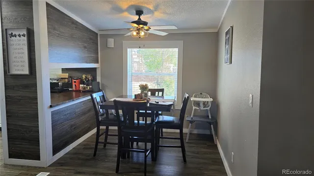 a view of a dining room with furniture and window