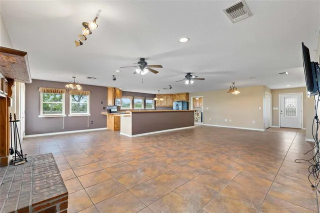 a view of a kitchen with a sink and a living room