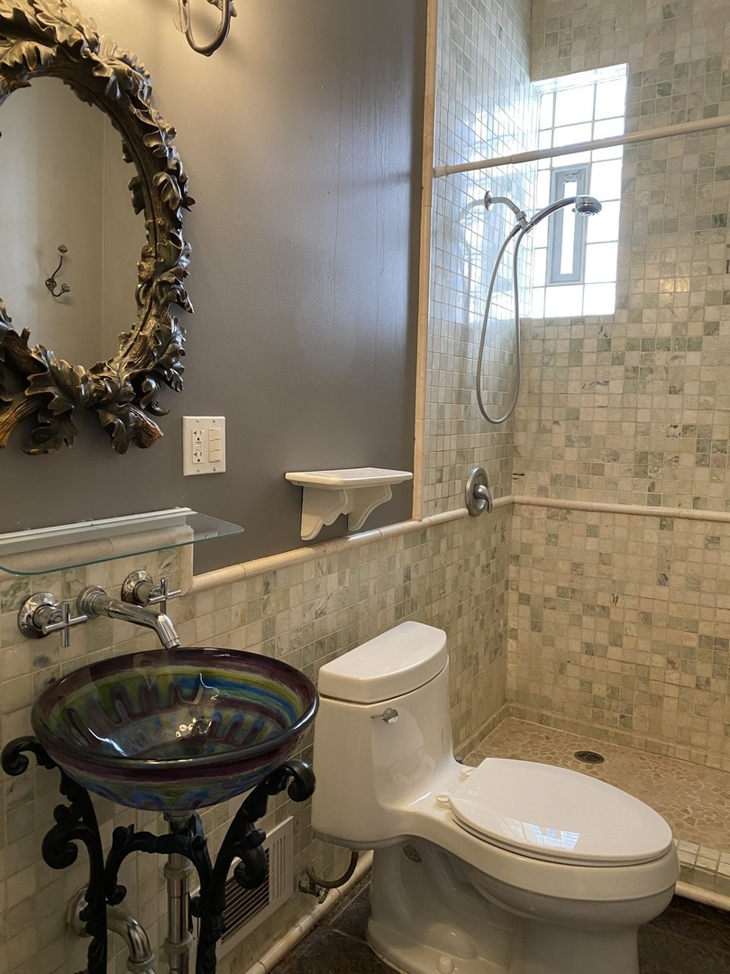 525 East 112th Street Chicago, IL 60628 - Photo 14 of 21 a bathroom with a sink and a toilet