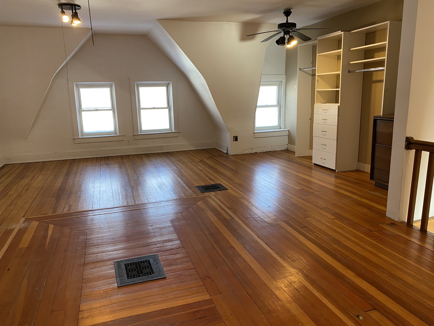 525 East 112th Street Chicago, IL 60628 - Photo 17 of 21 an empty room with wooden floor and windows