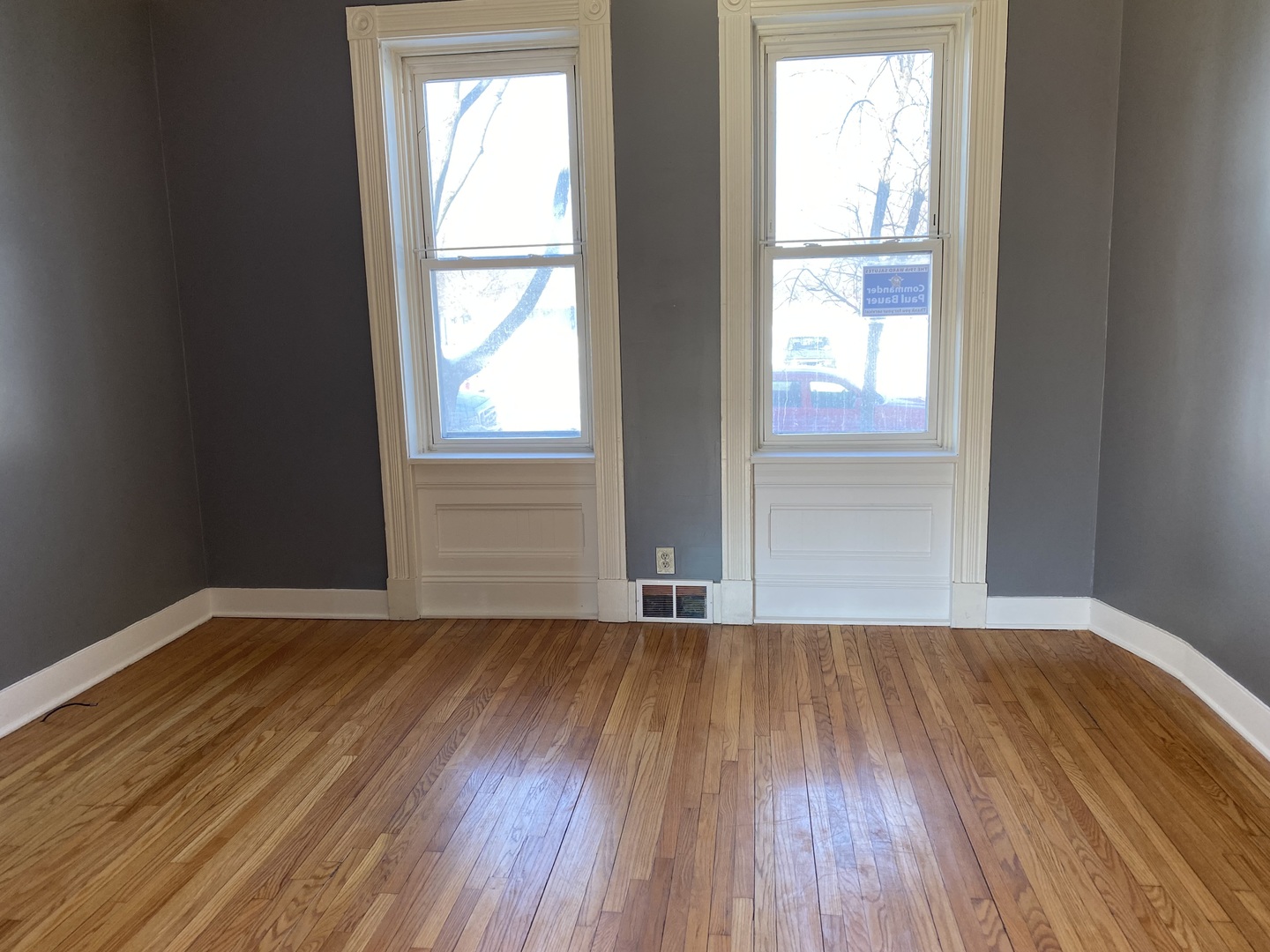 525 East 112th Street Chicago, IL 60628 - Photo 21 of 21 an empty room with wooden floor and windows