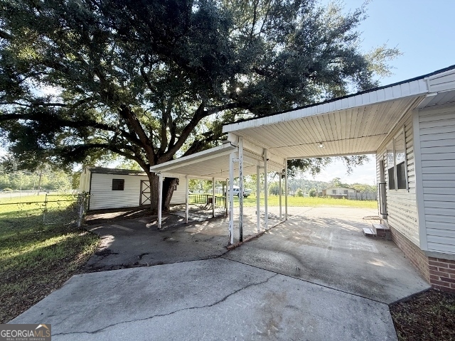 451 Lambs Bridge Road Swainsboro, GA 30401 - Photo 19 of 23 a view of a house with a yard