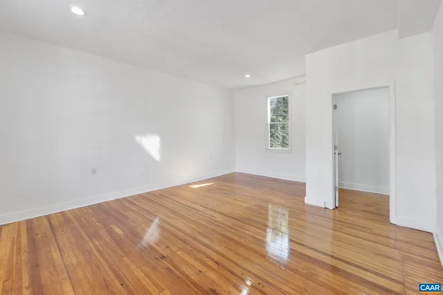 a kitchen with granite countertop a refrigerator and a stove top oven