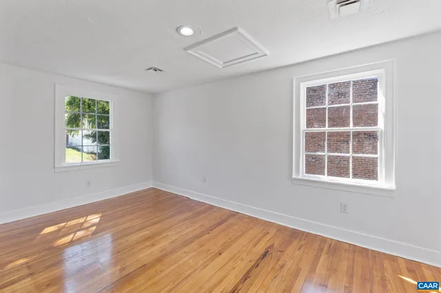 a bathroom with a sink toilet and a mirror