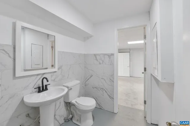 a view of a patio with iron fence