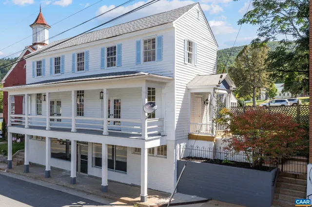 a view of a house with a tree