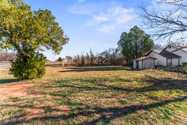 a yard with wooden fence