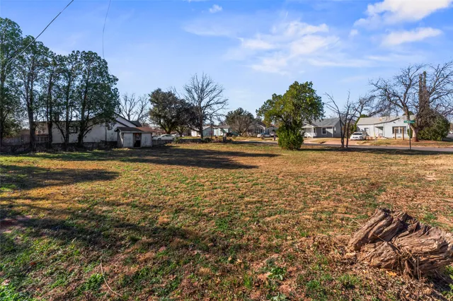 a view of a swimming pool with an outdoor space and seating area