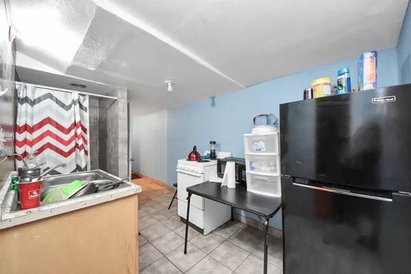 a living room with furniture and flowers