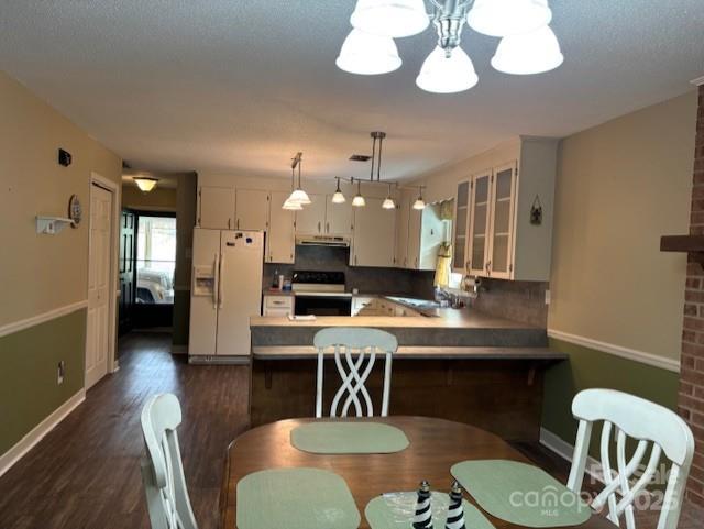 1250 21st Avenue Northeast Hickory, NC 28601 - Photo 4 of 27 a view of a dining room with furniture and wooden floor
