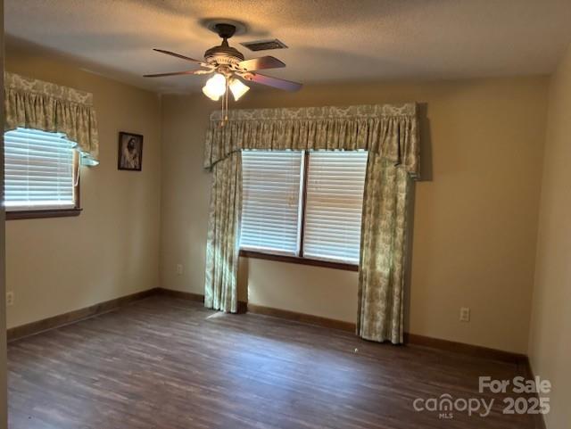 1250 21st Avenue Northeast Hickory, NC 28601 - Photo 7 of 27 an empty room with wooden floor and windows