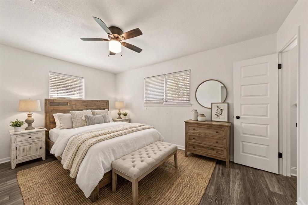 104 East Santa Anna Street Robinson, TX 76706 - Photo 25 of 36 a bedroom with a bed and wooden floor