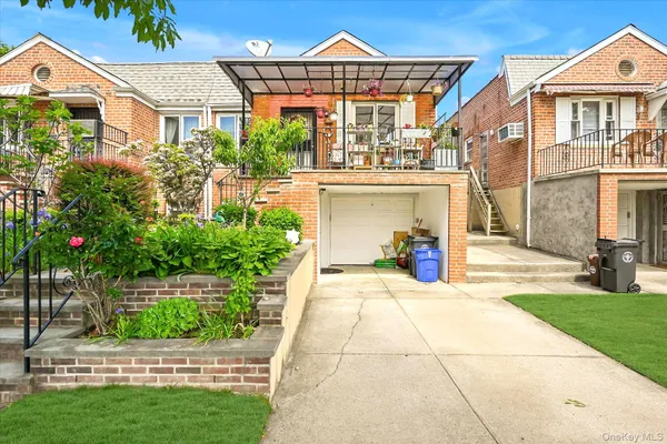 a view of a house with a small yard and plants