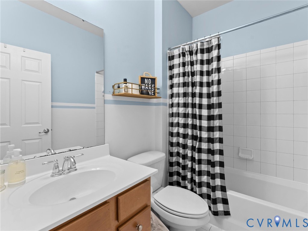 7434 South Franklins Way Quinton, VA 23141 - Photo 21 of 31 Full bathroom featuring a single vanity with wood-