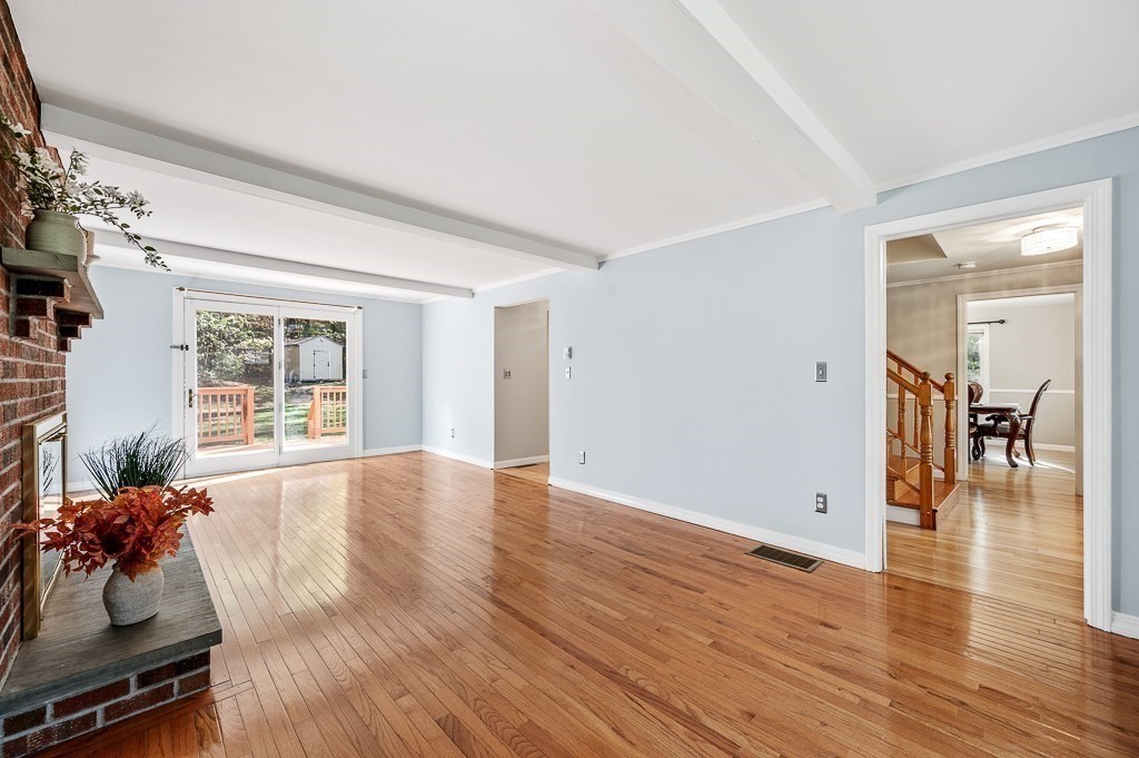 194 Paine Street Bellingham, MA 02019 - Photo 12 of 28 an empty room with wooden floor and windows