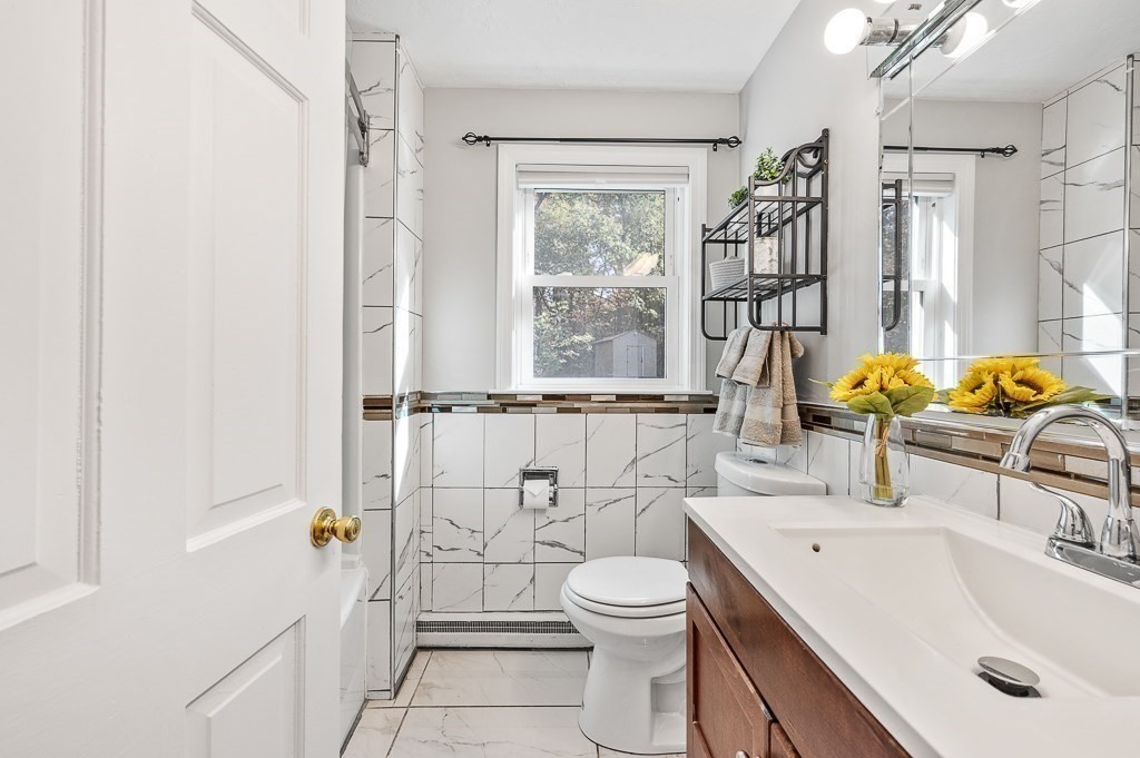 194 Paine Street Bellingham, MA 02019 - Photo 13 of 28 a bathroom with a sink toilet and shower