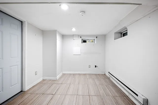 an empty room with wooden floor