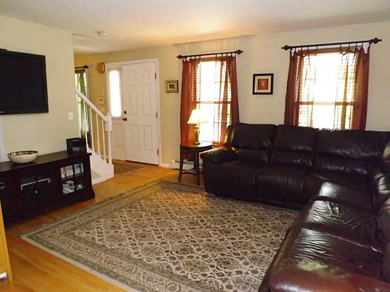 39 Old Road Charlestown, RI 02813 - Photo 3 of 23 Living Room. Hardwood floors begin at the front door and run through the living room and dining room.