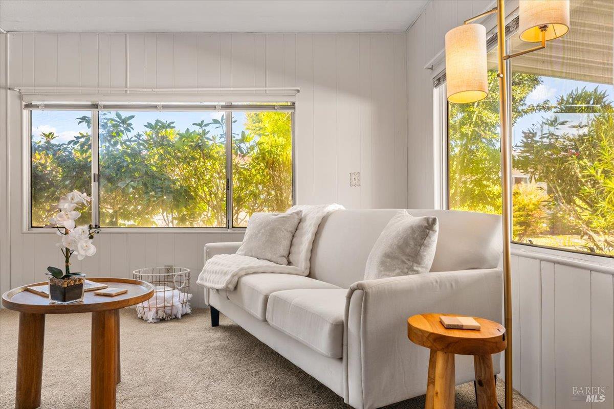 243 Parque Cabana Rohnert Park, CA 94928 - Photo 9 of 26 a living room with a couch and a large window