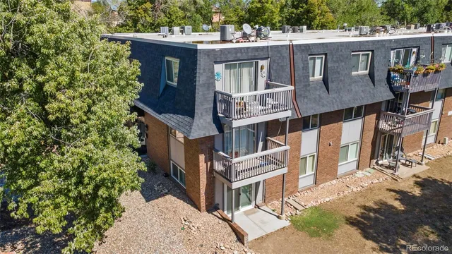 a front view of a house with a trees