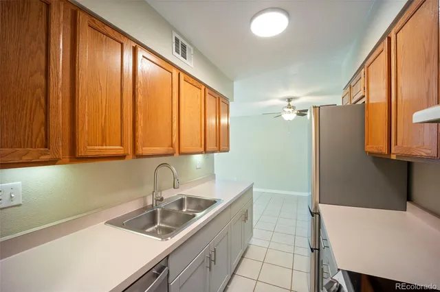 a kitchen with a sink cabinets and window