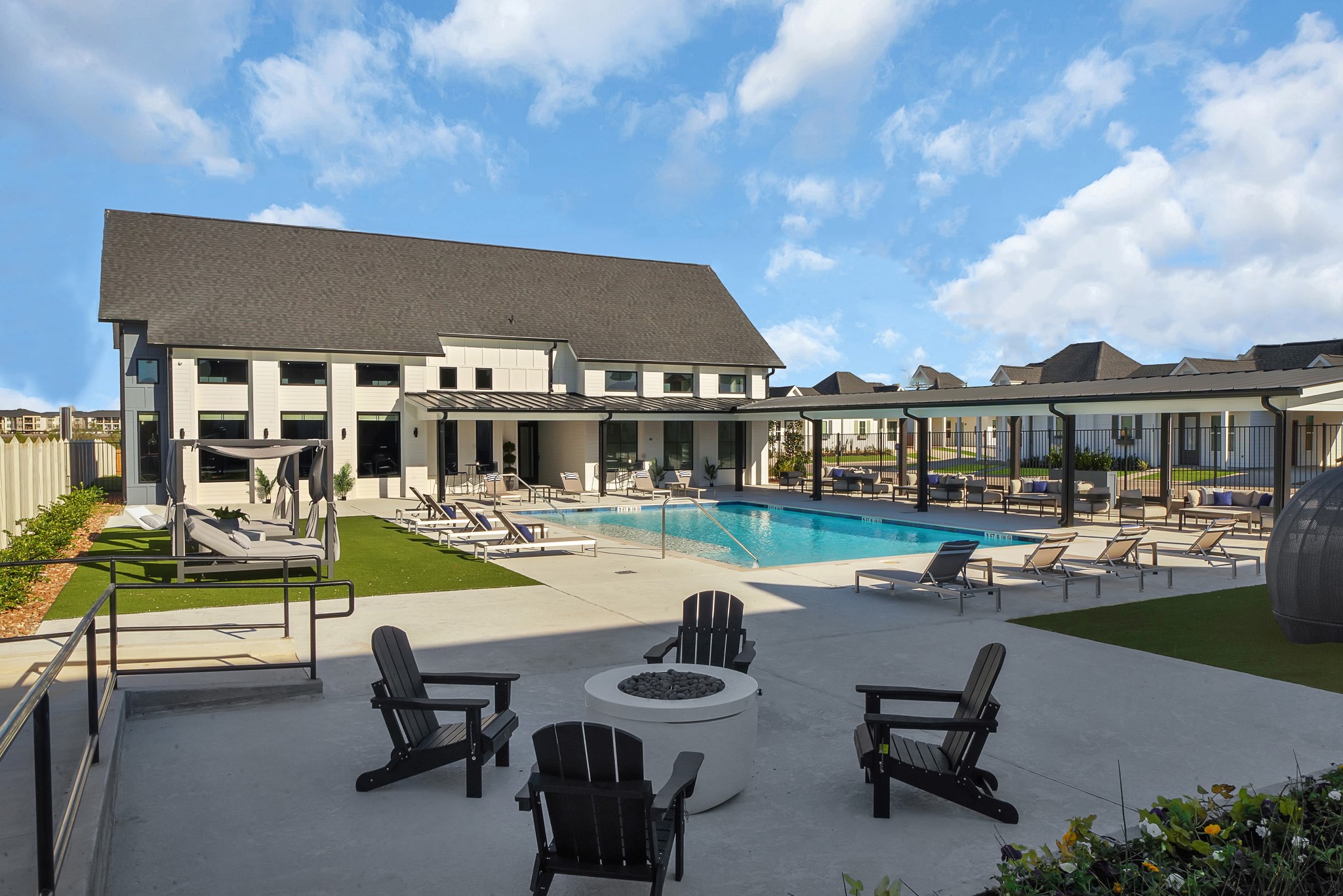 38634 Spur 149 Road, Unit 72A Magnolia, TX 77354 - Photo 29 of 48 a front view of a house with swimming pool having outdoor seating