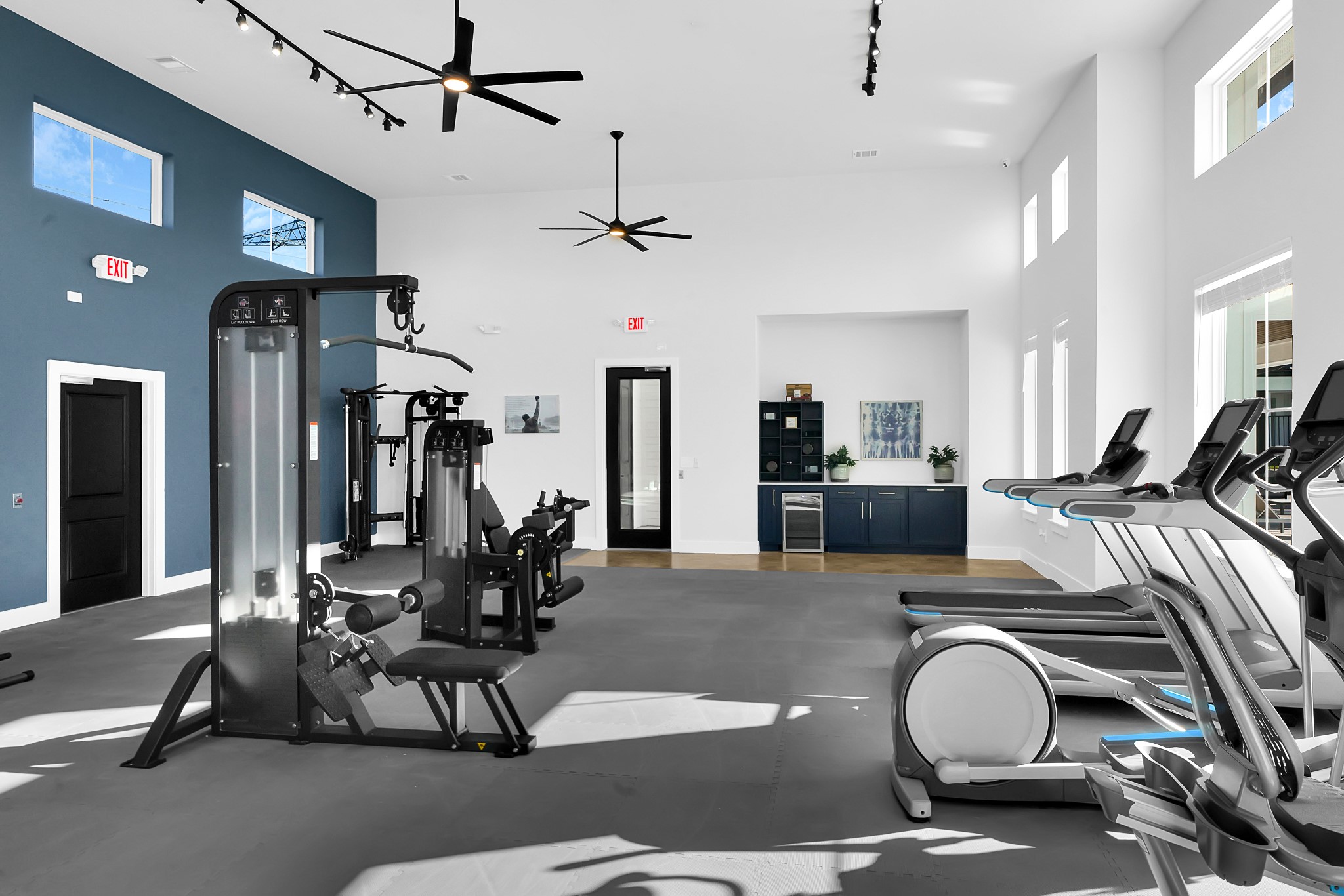 38634 Spur 149 Road, Unit 72A Magnolia, TX 77354 - Photo 34 of 48 a view of gym equipment and kitchen view