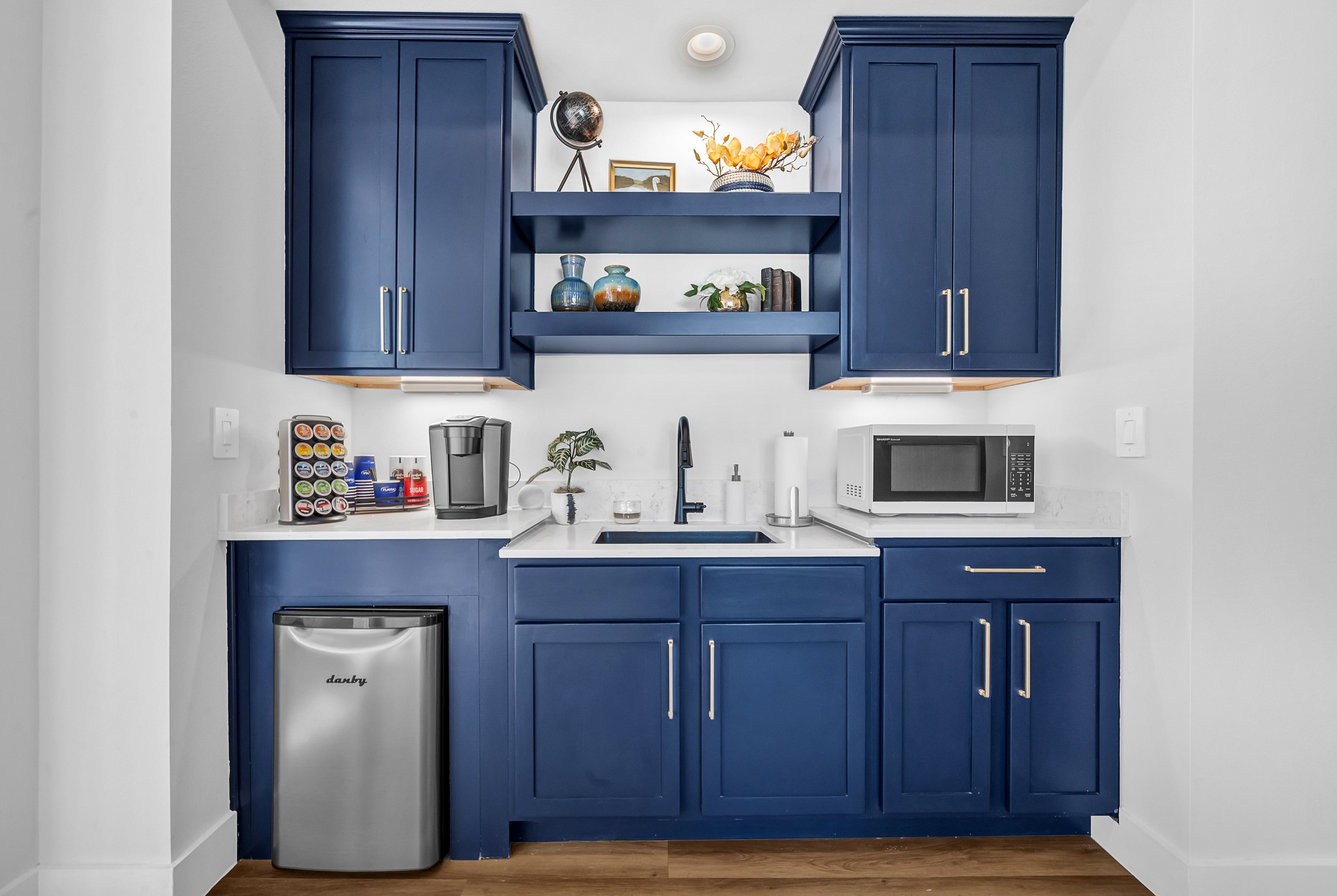 38634 Spur 149 Road, Unit 72A Magnolia, TX 77354 - Photo 42 of 48 a kitchen with stainless steel appliances granite countertop wooden cabinets and sink