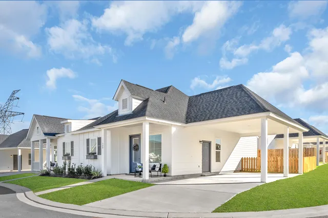 an aerial view of a house with a lake view