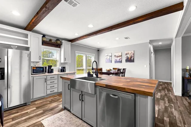a kitchen with sink cabinets and window