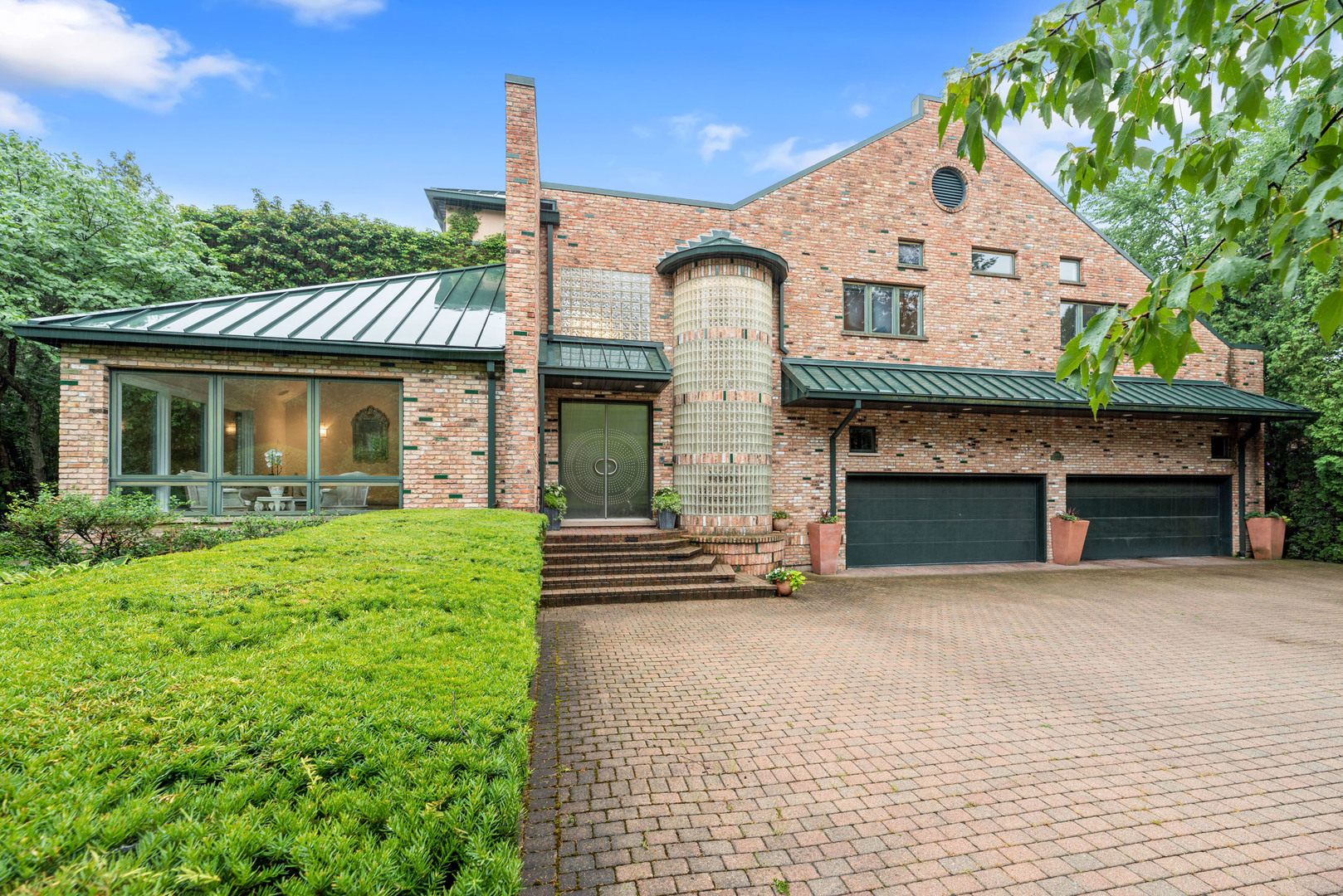 780 Bob-O-Link Road Highland Park, IL 60035 - Photo 46 of 50 a view of a house with a small yard and a large tree