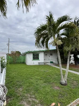 a house view with a garden space