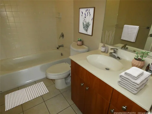 a bathroom with a sink a toilet and a bathtub