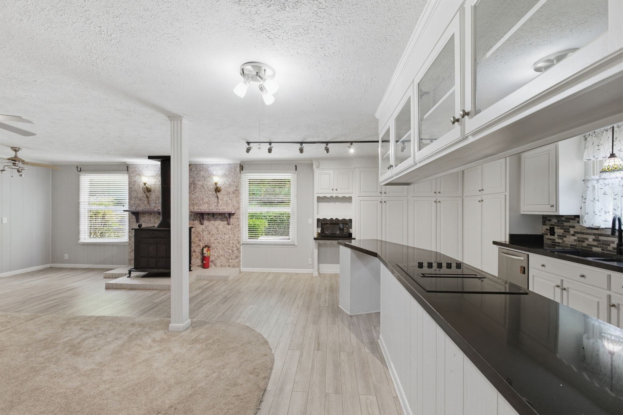 580 Defeated Creek Road Centerville, TN 37033 - Photo 14 of 71 a kitchen with granite countertop a refrigerator and a sink