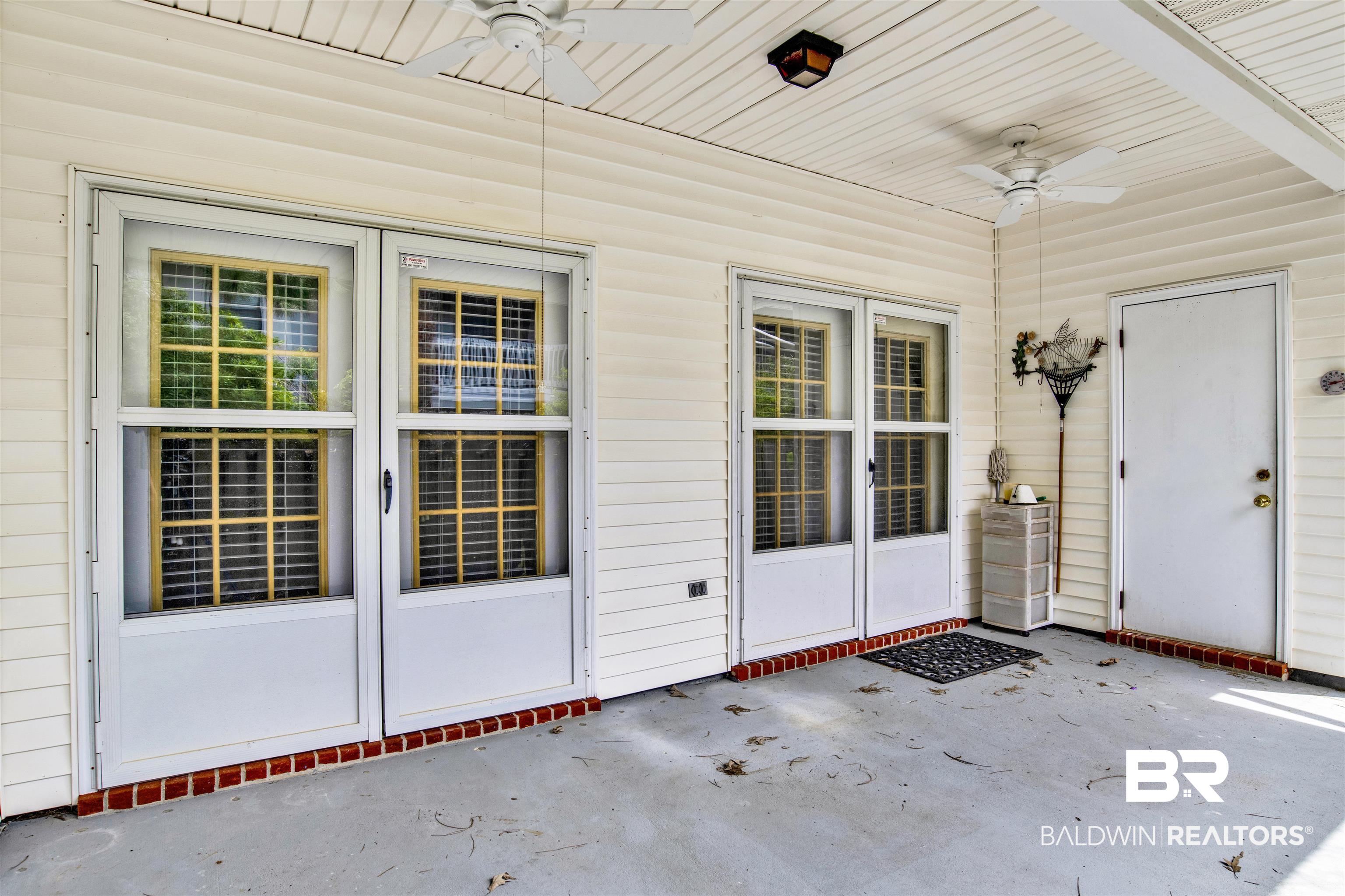 1258 Sutton Court, Unit 4 Mobile, AL 36609 - Photo 18 of 19 Property entrance featuring a ceiling fan and a patio