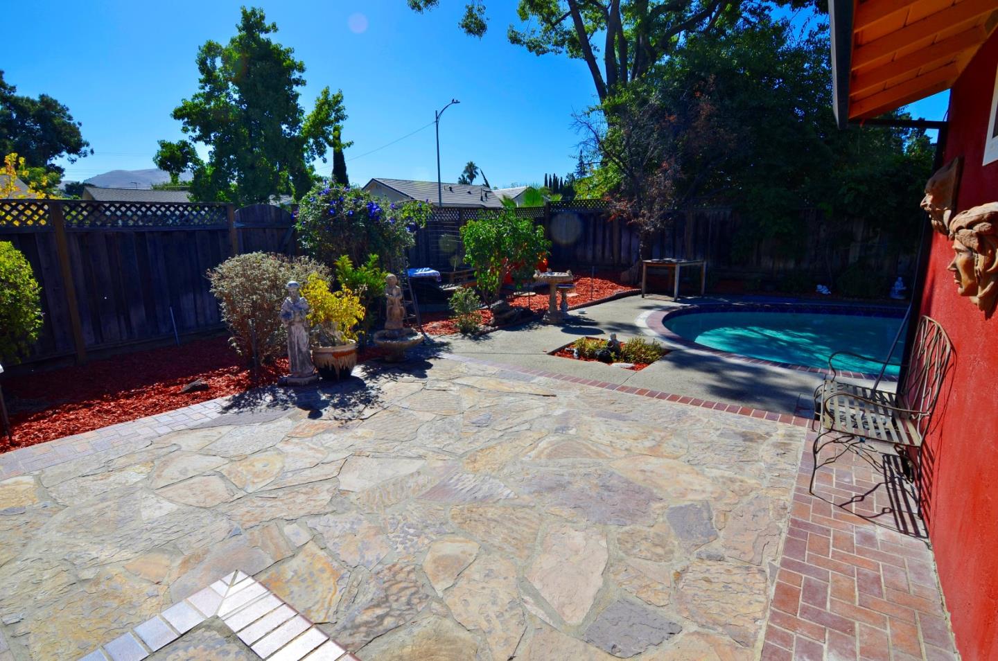 1920 Waycross Road Fremont, CA 94539 - Photo 2 of 13 a view of a backyard with chairs and potted plants