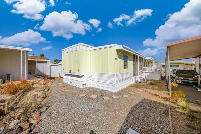a view of a patio with table and chairs with wooden floor