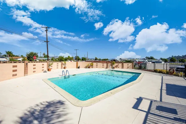 a living room with lots of furniture and a chandelier