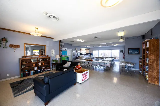 a living room with furniture and a table