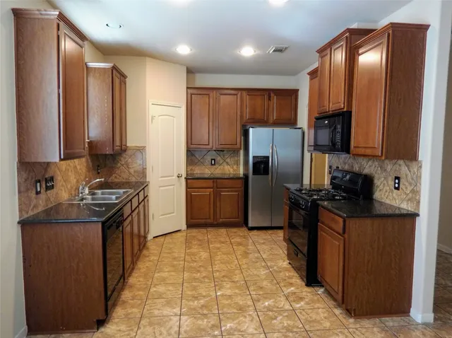 a view of a hallway with a chandelier