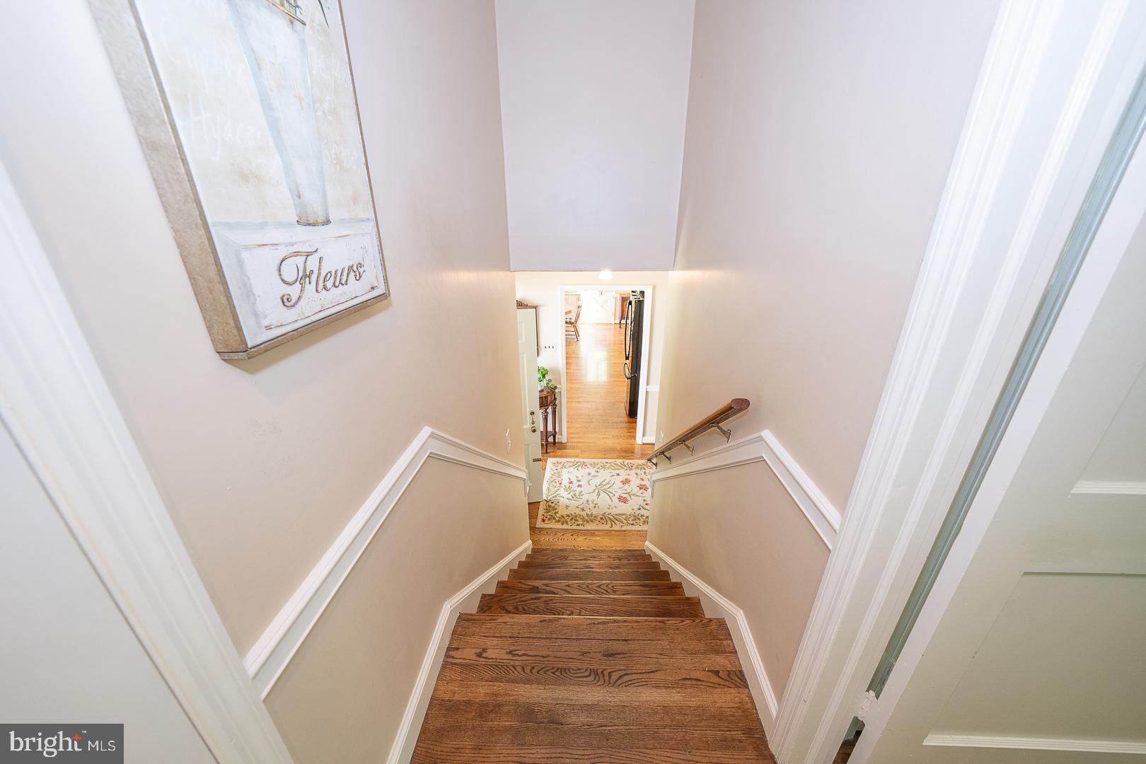 658 Conestoga Road Villanova, PA 19085 - Photo 26 of 57 a view of a hallway with wooden floor and staircase